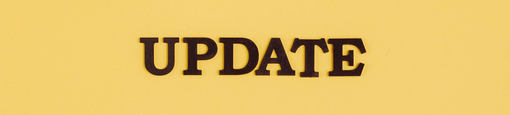 A bold black 'UPDATE' text on a yellow background, ideal for business or tech themes.